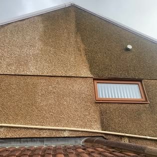 Pebble dash gable end after cleaning Pebble dash gable end after cleaning